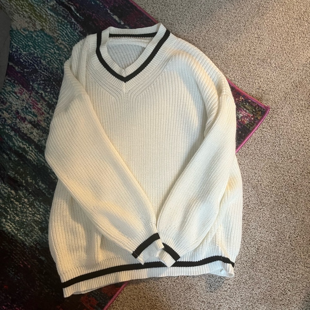 white with tiny black strips sweater